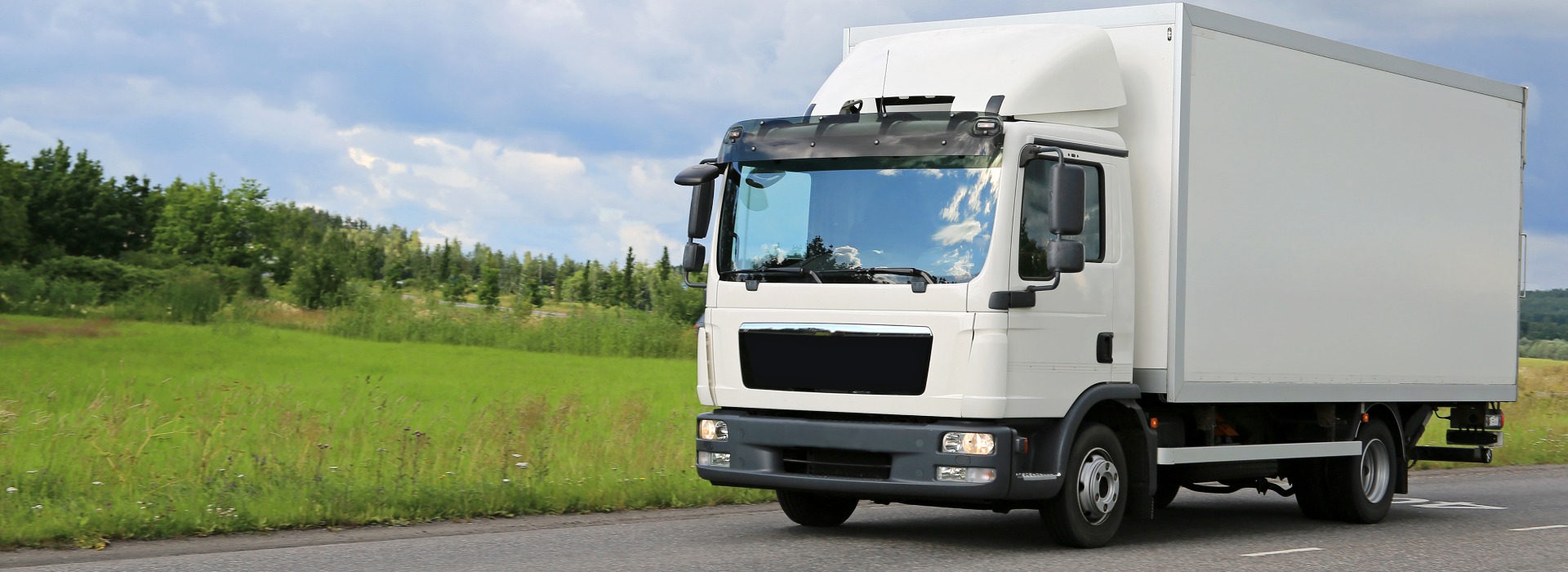 White Commercial Delivery Truck on the Road